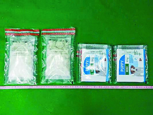 「K仔」毒品藏於朱古力及狗糧盒內。
