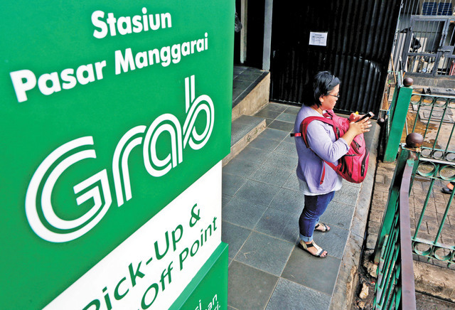 Grab靠叫車服務起家,如今將重心轉向餐飲外送及數字金融服務。路透社資料圖片